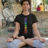 girl wearing 7 chakra yoga black tshirt and meditating