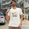 man wearing just play it holi tshirt