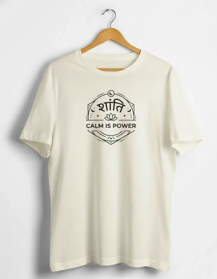 white T shirt with black print that says Shanti and Calm Is Power, with a small lotus design in the center, placed on a hanger against a plain background.