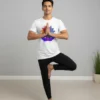 men wearing colorful chakra yoga lotus off-white yoga tshirt and performing tree yoga pose